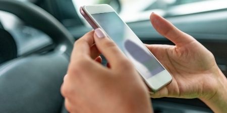 National Teen Driver Safety Week 2019 driver with phone